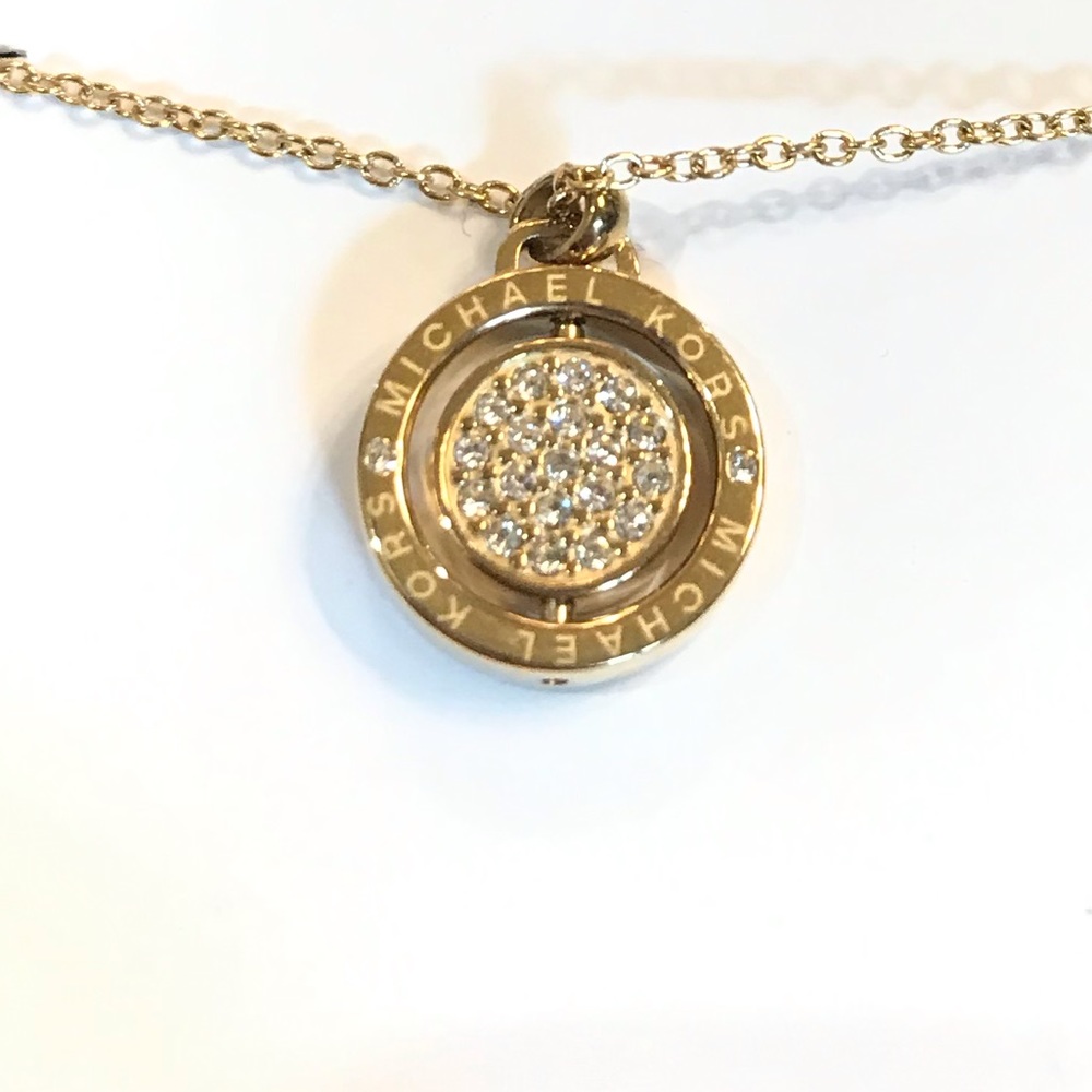 Michael Kors Gold Circle Flip Necklace.